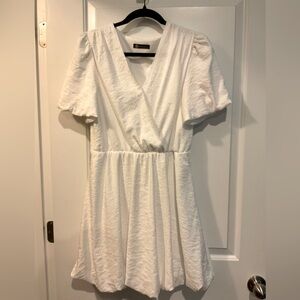 A white dress that has the perfect spin to it making you feel brand new.